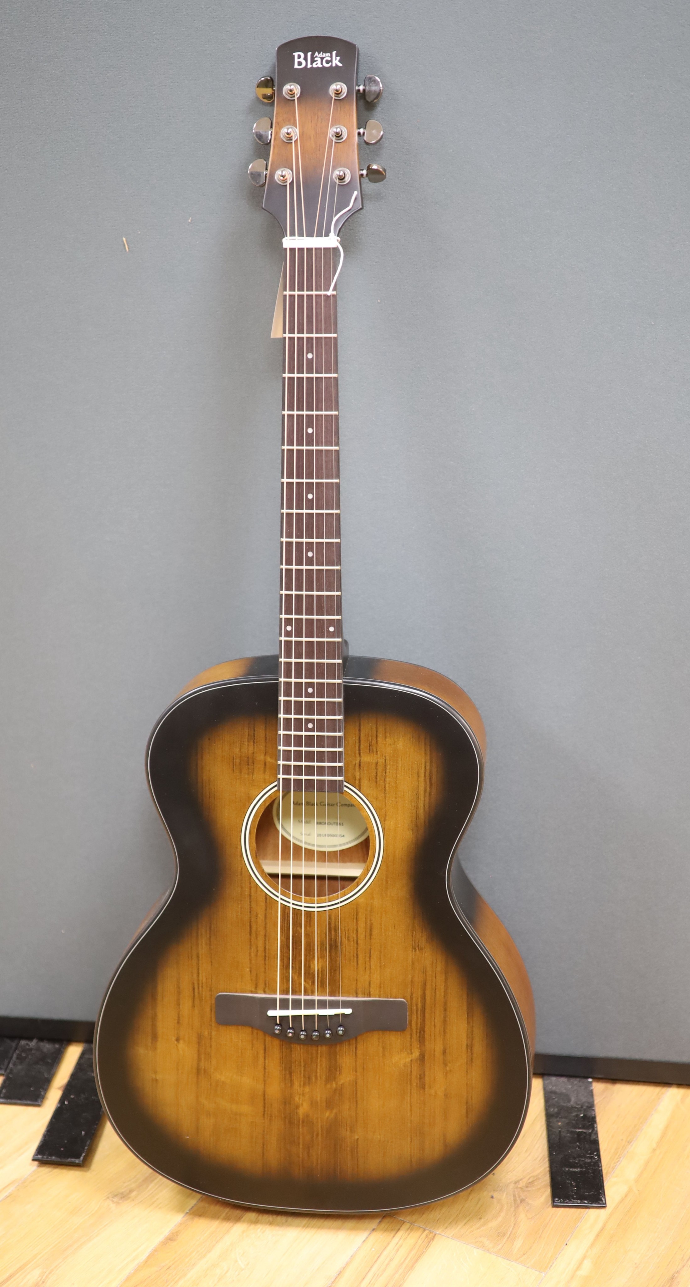 An Adam Black acoustic guitar